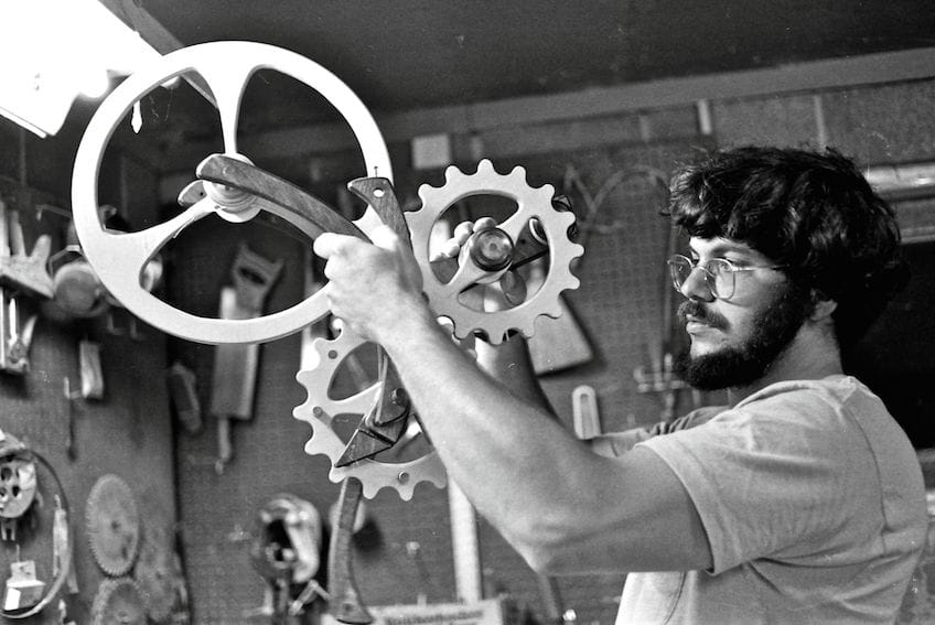 a person holding a large wheel