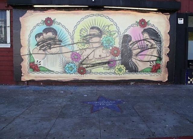 a wall with a mural of flowers