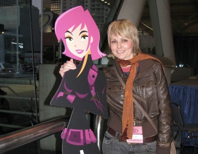 Mo Mellady holding a cartoon character