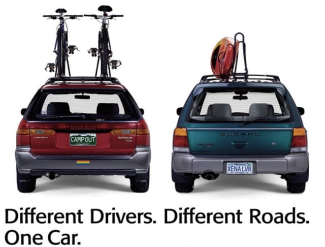 a couple of cars with a bike on top of them