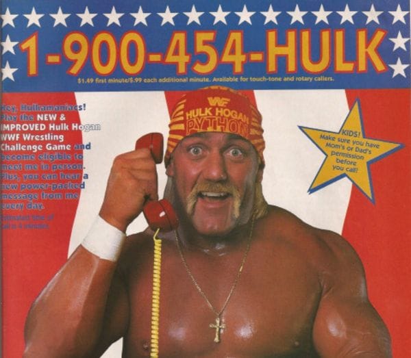 Hulk Hogan with a beard and a red hat holding a red object