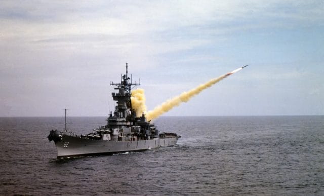 a large ship with a rocket launching