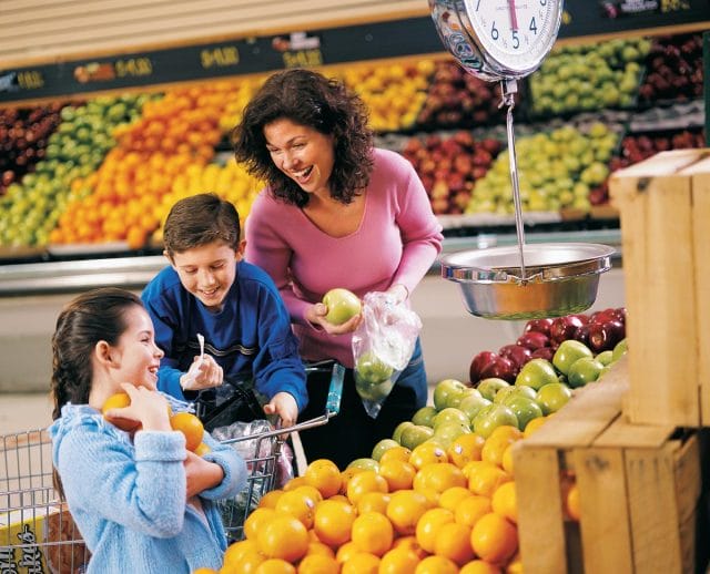 a person and children in a grocery store