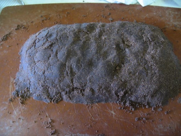 a black rock on a surface