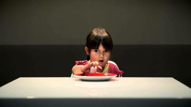 a baby eating from a bowl