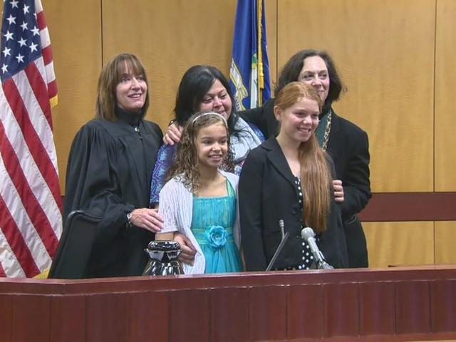 a group of people standing at a podium