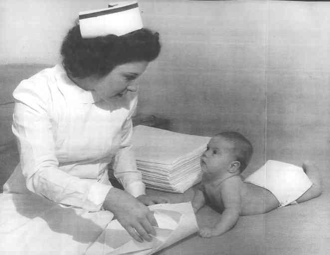 a person reading a book to a baby