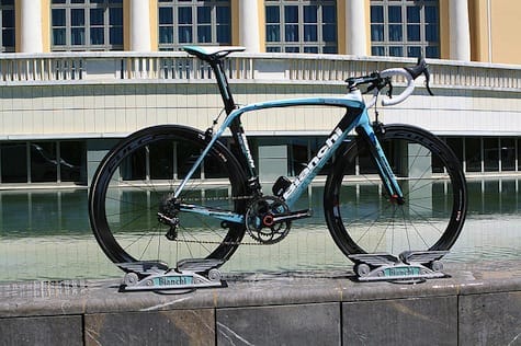 a bicycle parked on a railing