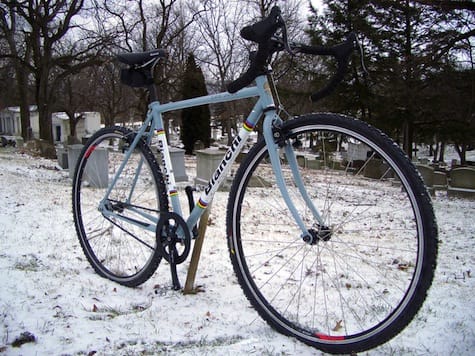 a bicycle parked in the snow
