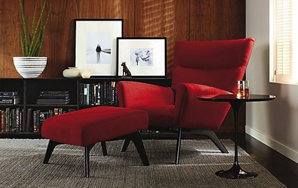 a red chair and a table in a room
