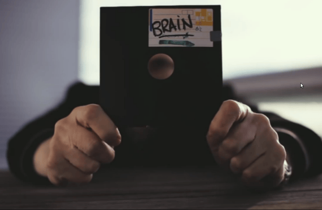 a person holding a black object