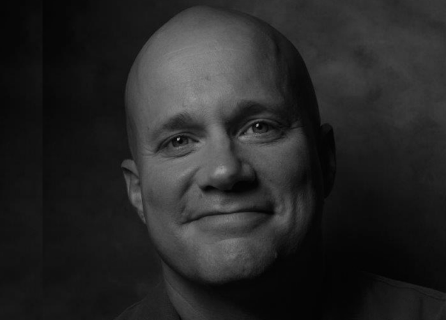 a man smiling for the camera