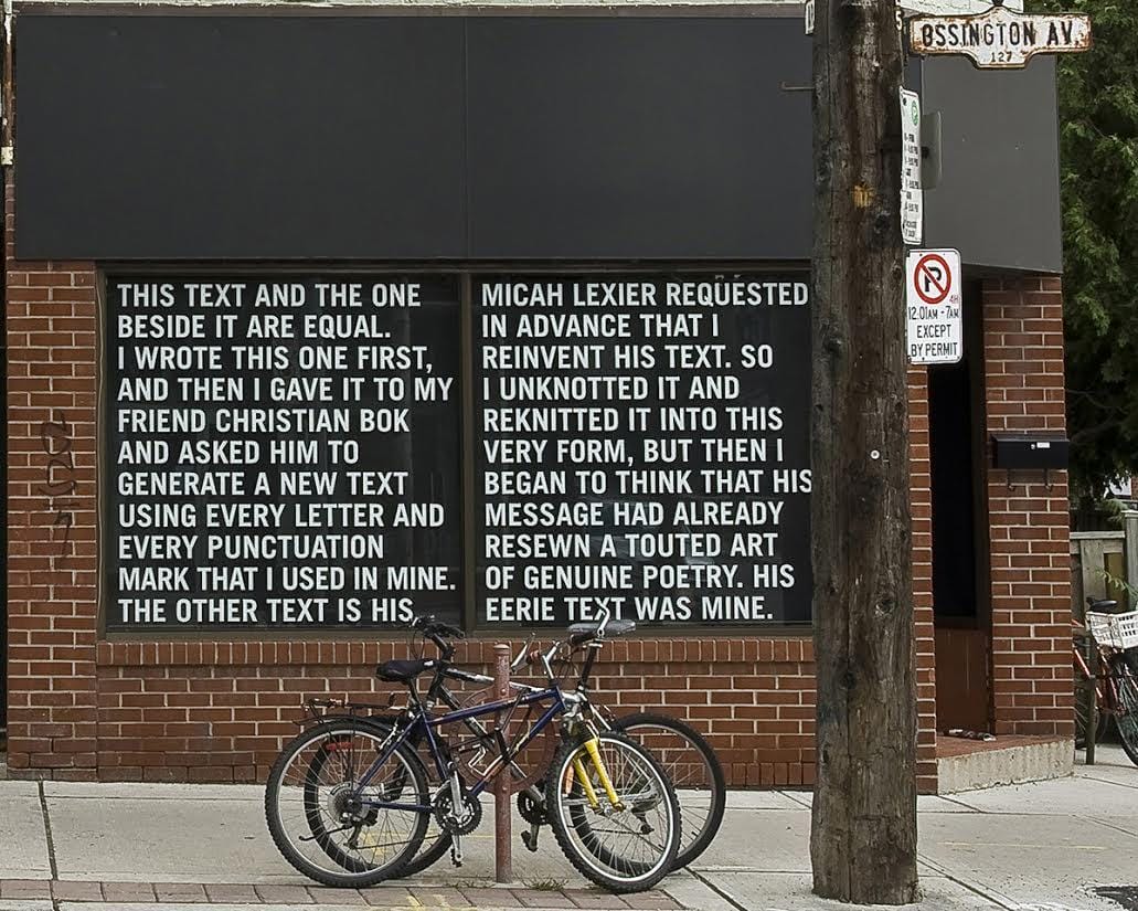 a bicycle is parked next to a sign