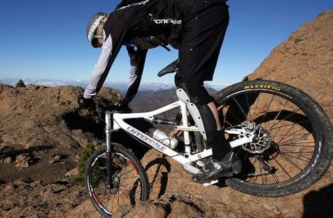 a person riding a bike on a dirt trail