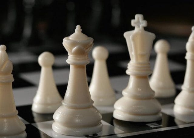 a chess board with white pieces