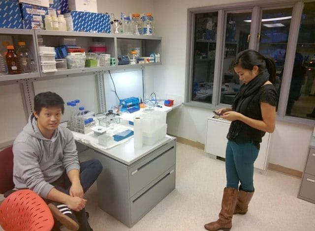 a person and a boy in a laboratory