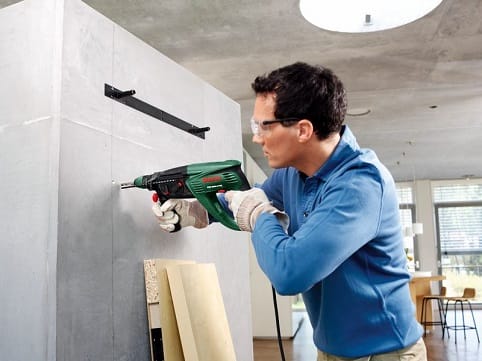 a person painting a wall