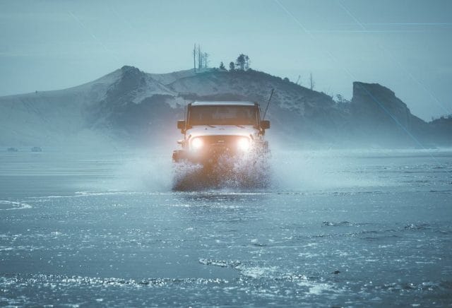 a truck driving through water
