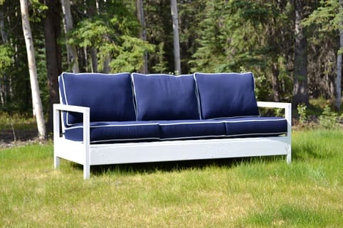 a couch in a grassy area