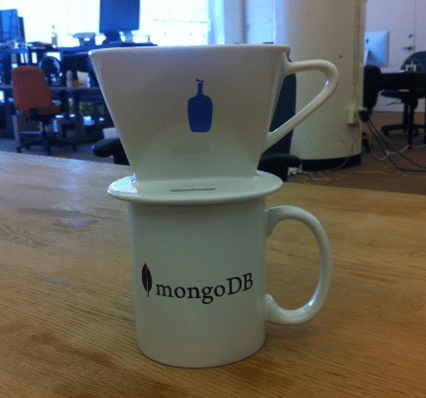 a white coffee cup on a table