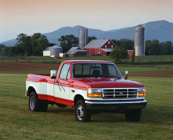 a red truck parked in a field