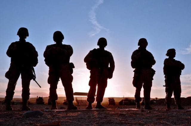 a group of people in military uniforms