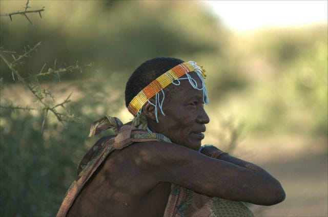 a man with a colorful headdress and a colorful head scarf