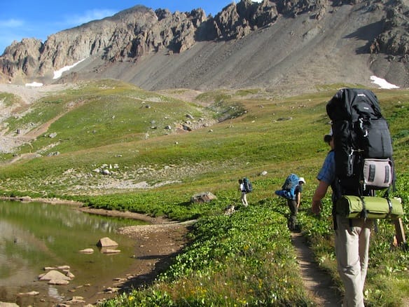 a group of hikers hiking in a mountain