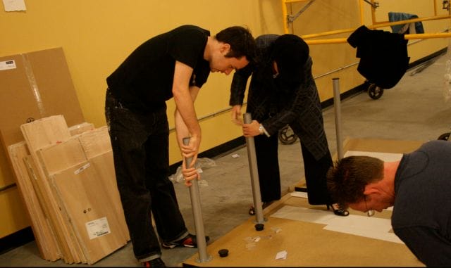 a group of people working on a machine