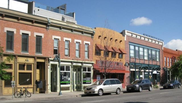 a street with cars and buildings