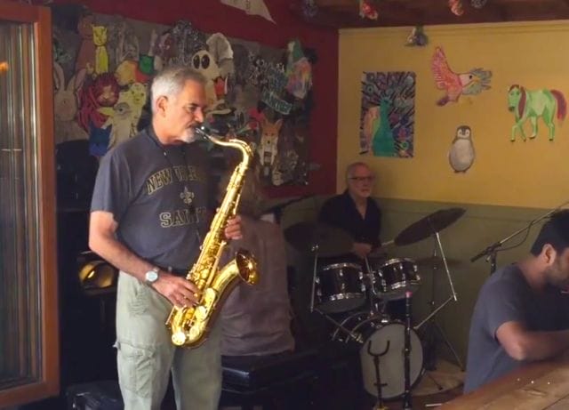a man playing a saxophone