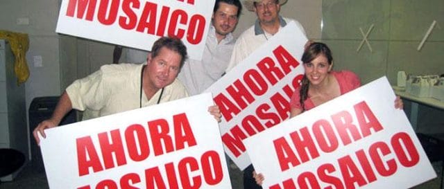 a group of people holding signs