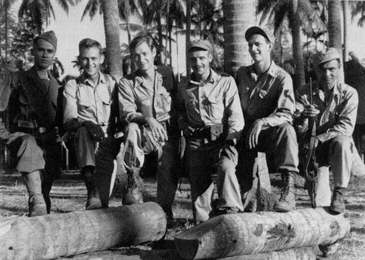 a group of men posing for a photo