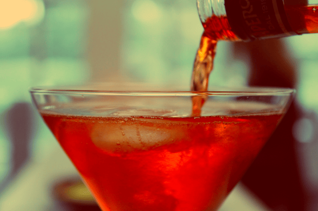 a glass of red liquid