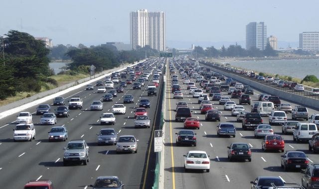 a highway with many cars