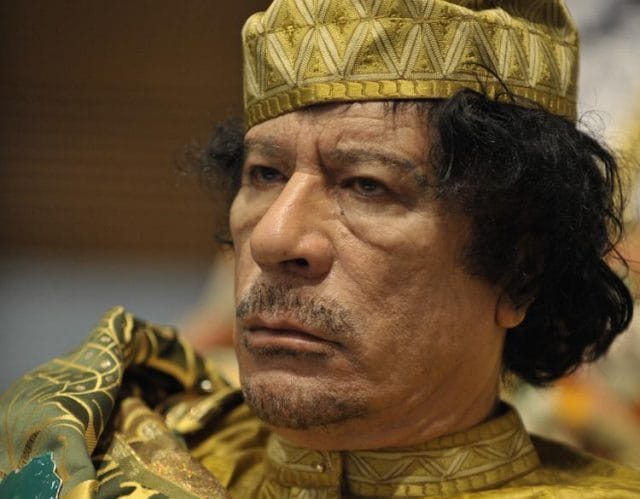 Muammar Gaddafi wearing a military uniform