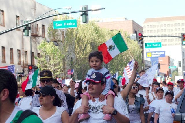 a group of people marching in the street