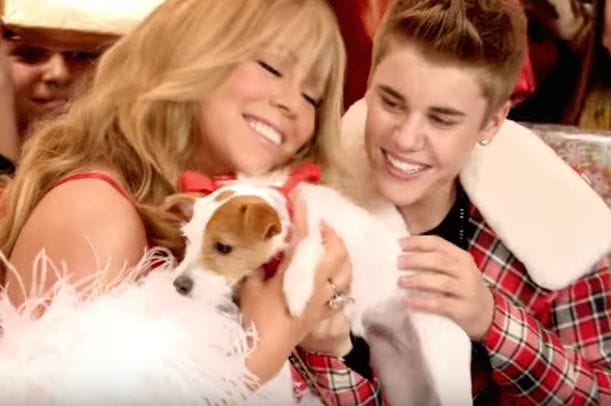 Justin Bieber and woman holding a dog
