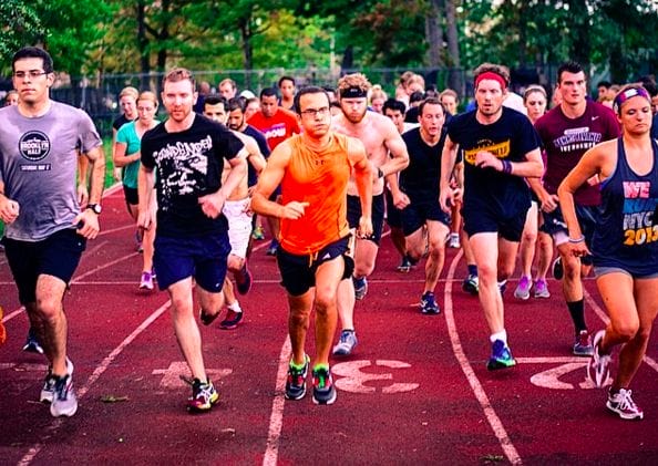a group of people running on a track
