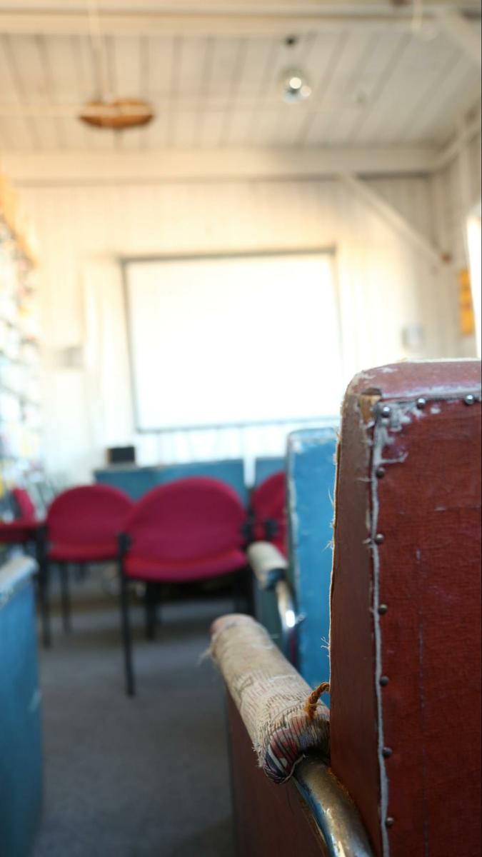 a room with a table and chairs