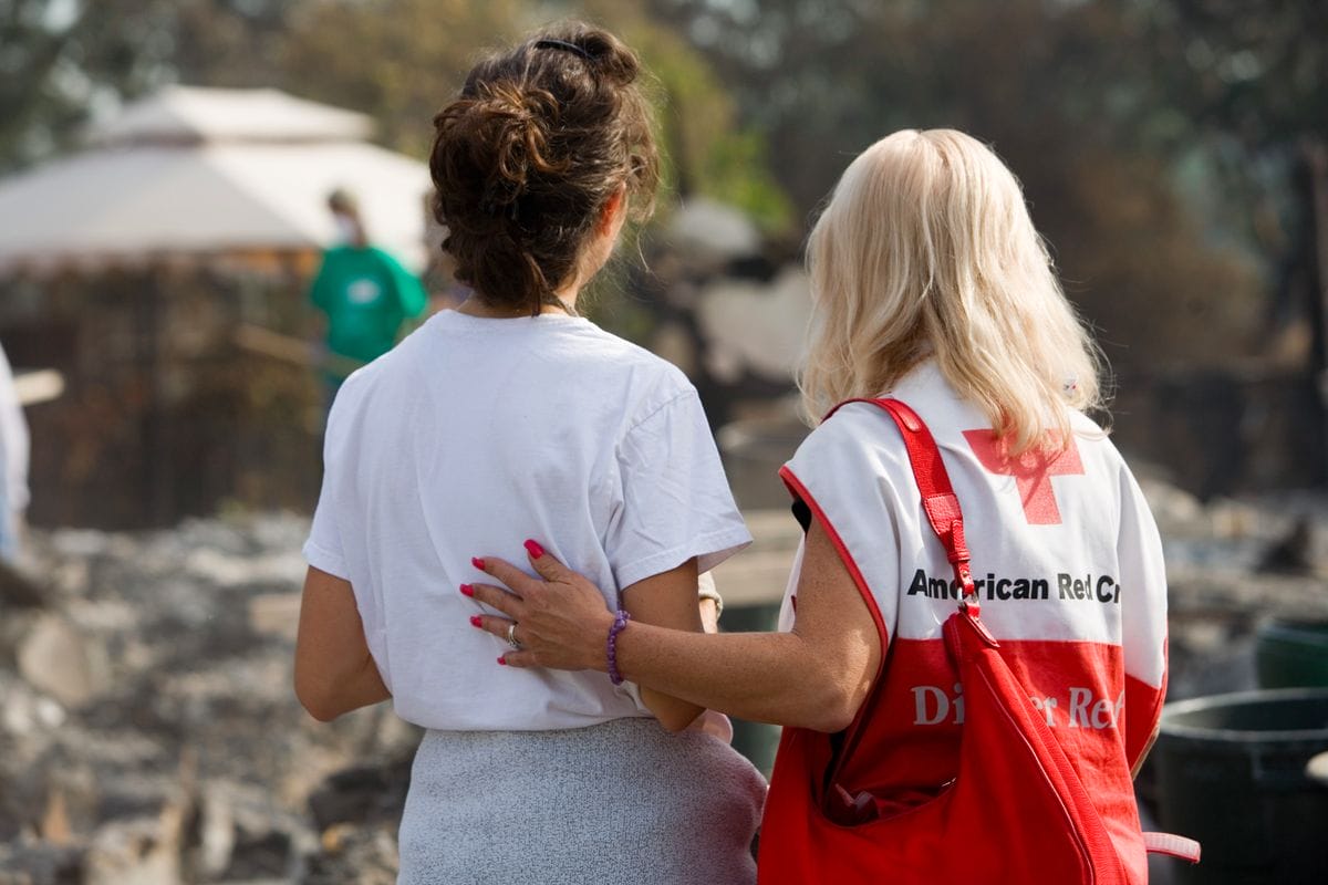 a couple of women wearing backpacks