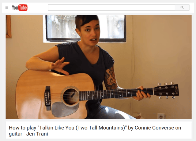 a boy playing a guitar