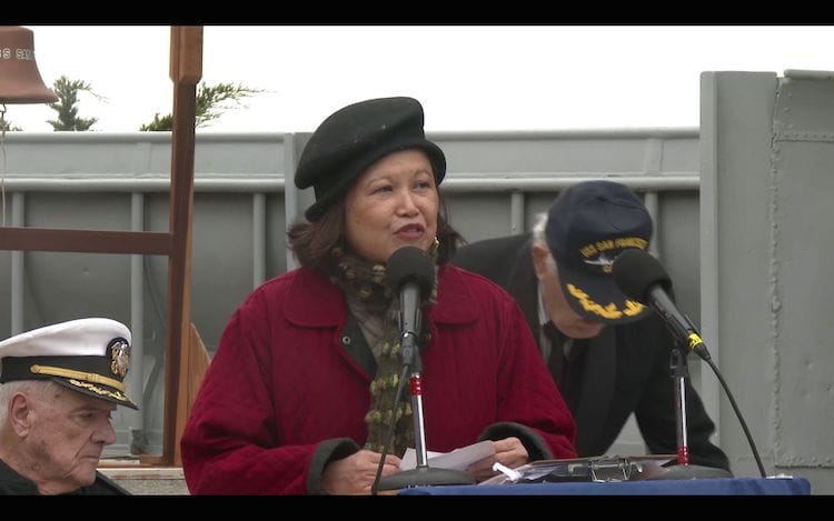 a person speaking into a microphone