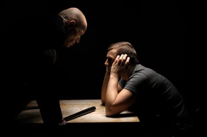 a man and a woman looking at a table