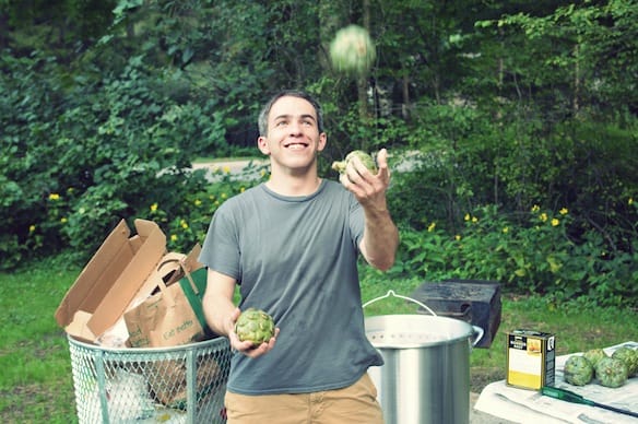 a man holding a fruit