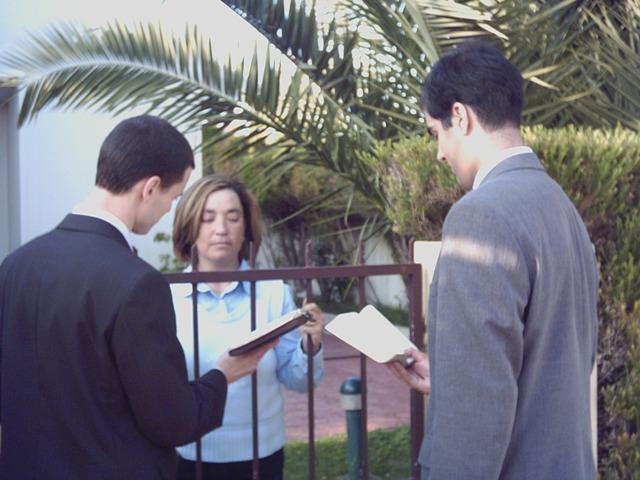 a few people looking at a paper