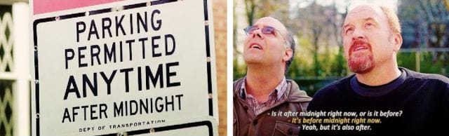 two men standing next to a sign