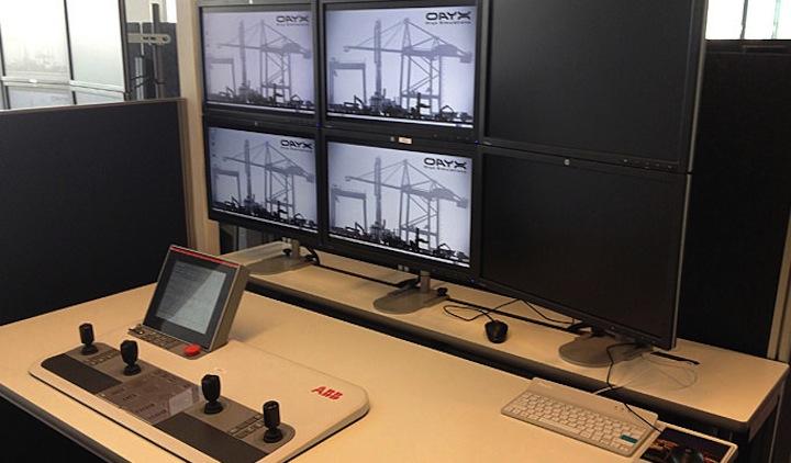 a computer desk with a couple of monitors and a keyboard