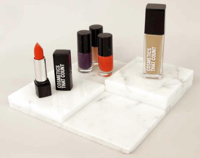 a group of different colored lipsticks