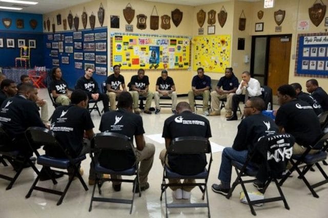 a group of people sitting in chairs
